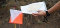 Athlete uses navigation equipment for orienteering,compass and topographic map