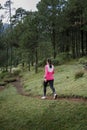 Athlete walking in the forest after running