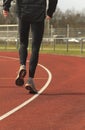 Athlete warming up on a race track Royalty Free Stock Photo