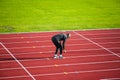 An athlete warming up for running practice at the Parliament Hill athletics track in Hampstead Heath Royalty Free Stock Photo