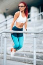 Active athlete woman doing exercises and working out. Fitness training concept Royalty Free Stock Photo