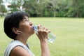Athlete woman drinking water after exercise Royalty Free Stock Photo