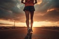 Athlete woman runner training run on the road. Morning jogging for a healthy lifestyle under the sunrise sky. Cardio exercise. Fit