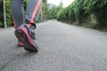 Athlete woman`s feet with running shoe walking in public park.female active lifestyle for future competition concept