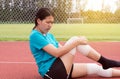 Athlete woman suffering from pain in legs with knee injury after sport exercise running jogging and workout Royalty Free Stock Photo