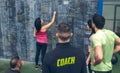 Athlete woman writing down results on the gym blackboard Royalty Free Stock Photo