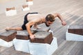 Athlete yogi man doing balance training in the city park