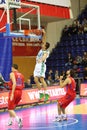 Athlete from Zalgiris team throws ball into basketball hoop