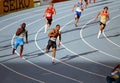 Athletes on the 4 x 100 meters relay race Royalty Free Stock Photo