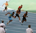 Athletes on the 4 x 100 meters relay race Royalty Free Stock Photo