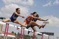 Athletes Clearing Hurdles In Race Royalty Free Stock Photo