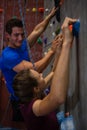 Athletes climbing wall in health club Royalty Free Stock Photo