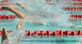 Frantic splashing at the start of a swimming race. Swimmers diving in the water Royalty Free Stock Photo