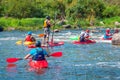 Athletes kayakers during training on whitewater. Man on inflatable stand up paddle board SUP