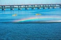 Athletes in kayaks in training near the river fountain in a rainbow of splashes Royalty Free Stock Photo