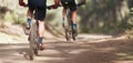 Athletes mountain biking on forest trail Royalty Free Stock Photo