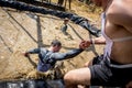 Athletes overcome obstacles in the adventure race Royalty Free Stock Photo