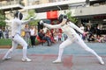 Athletes perform fencing