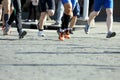 Athletes run marathons on the pavement