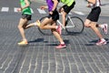 Athletes run marathons on the pavement Royalty Free Stock Photo