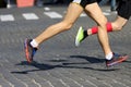 Athletes run marathons on the pavement Royalty Free Stock Photo