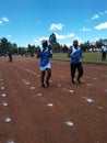 Athletes running ,in afield in acool weather