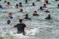 Athletes running into a lake