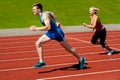 Athletes running on race track Royalty Free Stock Photo