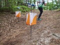 Athletes rush to the checkpoint on the trail through forest