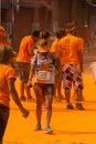 Athletes are seen covered in orange powder during a colorful race at Dique do Tororo in the city of Salvador, Bahia