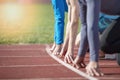 Athletes at the sprint start line in track and field Royalty Free Stock Photo