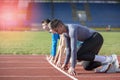 Athletes at the sprint start line in track and field Royalty Free Stock Photo