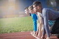 Athletes at the sprint start line in track and field Royalty Free Stock Photo