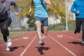 Athletes at the sprint start line in track and field Royalty Free Stock Photo