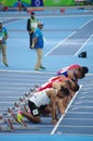 Athletes at start line of 100m sprint run