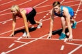 Athletes at starting line on race track