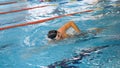 Athletes, swimmers training along tracks in sports pool for swimming, healthy lifestyle concept. Swimmers in blue, clear