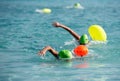 Athletes swimming free style in the sea Racing competition. Swimmer in the ocean