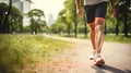 Athletes walk for exercise in a public park in the evening.