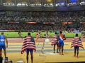 Athletes watching women's 4x100 m relay sprint