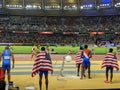 Athletes watching women's 4x100 m relay sprint Royalty Free Stock Photo