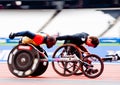 Athletes on wheelchairs racing