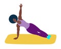 An athletic African-American woman does yoga