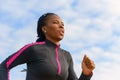 Athletic African woman out for her daily jog Royalty Free Stock Photo