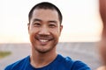 Athletic Asian man taking a selfie during a morning run Royalty Free Stock Photo