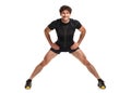 Athletic attractive man doing fitness exersise on the white Royalty Free Stock Photo