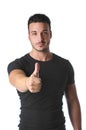 Athletic and attractive young man with thumb up doing OK sign Royalty Free Stock Photo