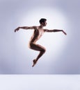 Athletic ballet dancer in a perfect shape performing