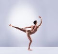 Athletic ballet dancer performing in a studio Royalty Free Stock Photo