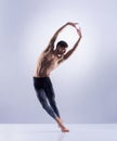 Athletic ballet dancer performing in a studio Royalty Free Stock Photo